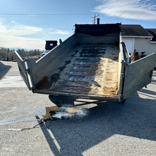 A dumpbox of a dump truck.
